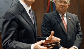 ** FILE ** Sen. Thad Cochran (left), Mississippi Republican, is pictured with then-Mississippi Gov. Haley Barbour, a fellow GOP member, in 2011. (Associated Press)