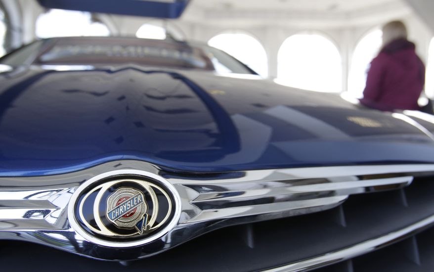 A 2011 Chrysler 200 is on display in a dealer's showroom in Burlingame, Calif., in February 2011. (AP Photo/Paul Sakuma, File)