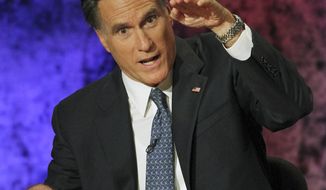 Former Massachusetts Gov. Mitt Romney makes his point during a Republican presidential debate on Oct. 11, 2011, at Dartmouth College in Hanover, N.H. (Associated Press)