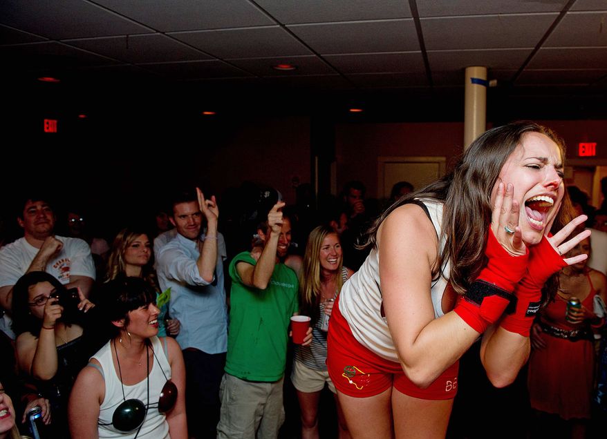 Sarah DeLucas, aka "Bocce Balboa," of the District, revels in her first-round win at the D.C. Lady Arm Wrestlers event in June. As with roller derby, many of the arm-wrestlers adopt colorful alter egos. (Barbara L. Salisbury/The Washington Times)