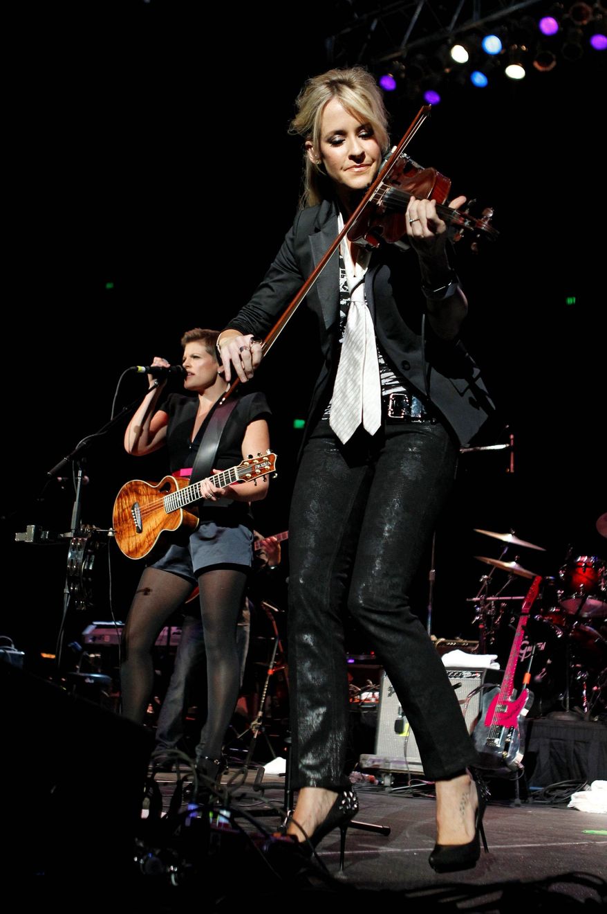 The Dixie Chicks didn't fiddle around before accepting an invitation to participate in a concert to help raise money for victims of the Texas wildfires this summer. (Associated Press)