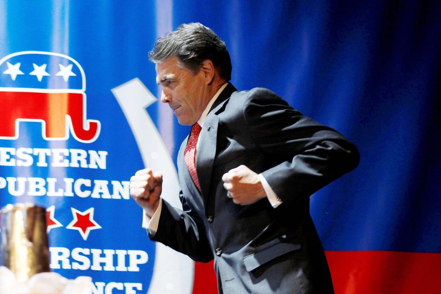 Texas Gov. Rick Perry runs to deliver a keynote address during the Western Republican Leadership Conference in Las Vegas on Wednesday. (Associated Press)