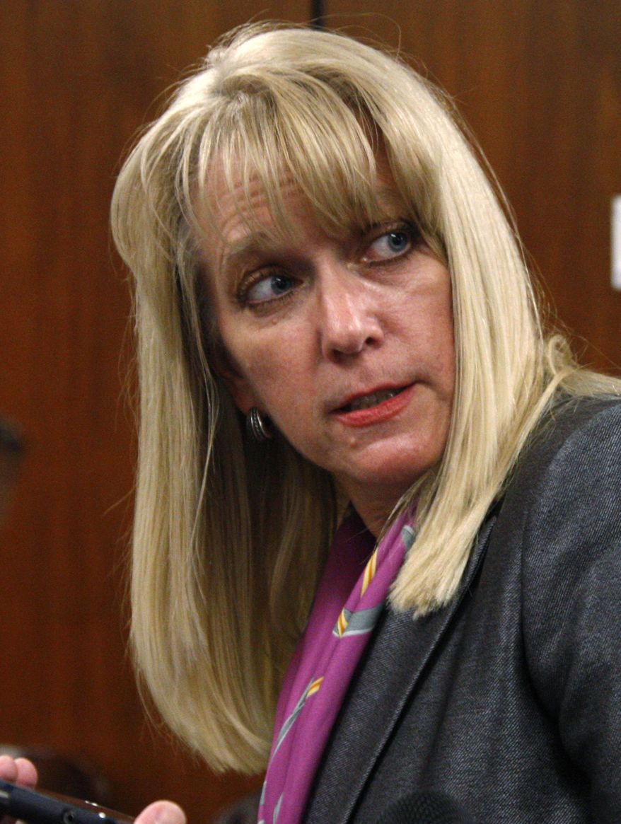 Victoria Tindall, an Oklahoma assistant attorney general, answers a question following a hearing on a state abortion law on Tuesday, Oct. 18, 2011, in Oklahoma City. (AP Photo/Sue Ogrocki)