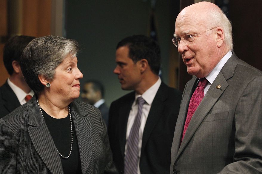 Homeland Security Secretary Janet Napolitano speaks with Sen. Patrick J. Leahy (right), Senate Judiciary Committee chairman, prior to her testimony before the panel on Wednesday, Oct. 19, 2011, on Capitol Hill in Washington. (AP Photo/Haraz N. Ghanbari)