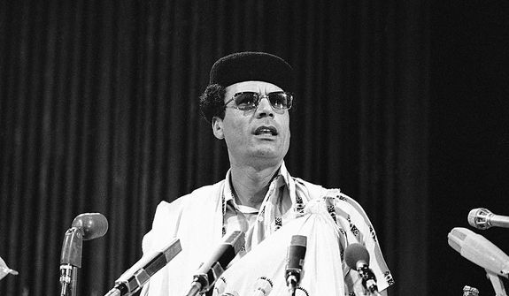 In this photo from Aug. 18, 1976, Libyan leader Col. Moammar Gadhafi speaks to the summit meeting of the nonaligned nations in Colombo, Sri Lanka. (Associated Press)