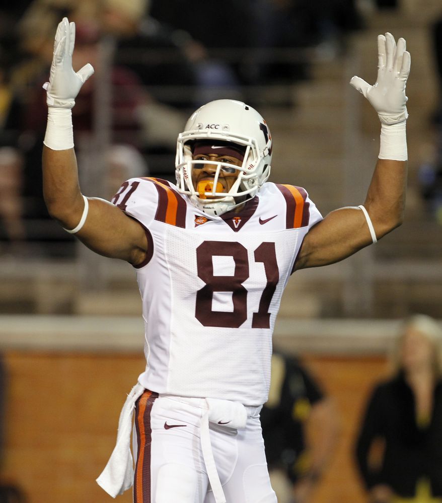 Virginia Tech 's Jarrett Boykin signals a touchdown against Wake Forest during the first half in Winston-Salem, N.C. on Saturday Oct. 15, 2011. Virginia Tech won 38-17. (AP Photo/Bob Leverone)