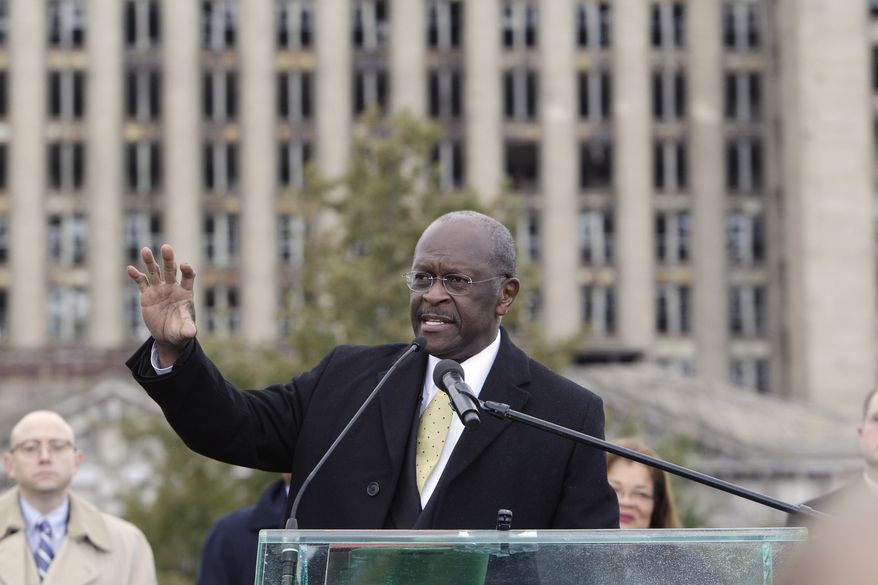 Republican presidential candidate Herman Cain addresses the crowd in front of the vacant Michigan Central Station during a campaign stop in Detroit on Oct. 21, 2011. (Associated Press)