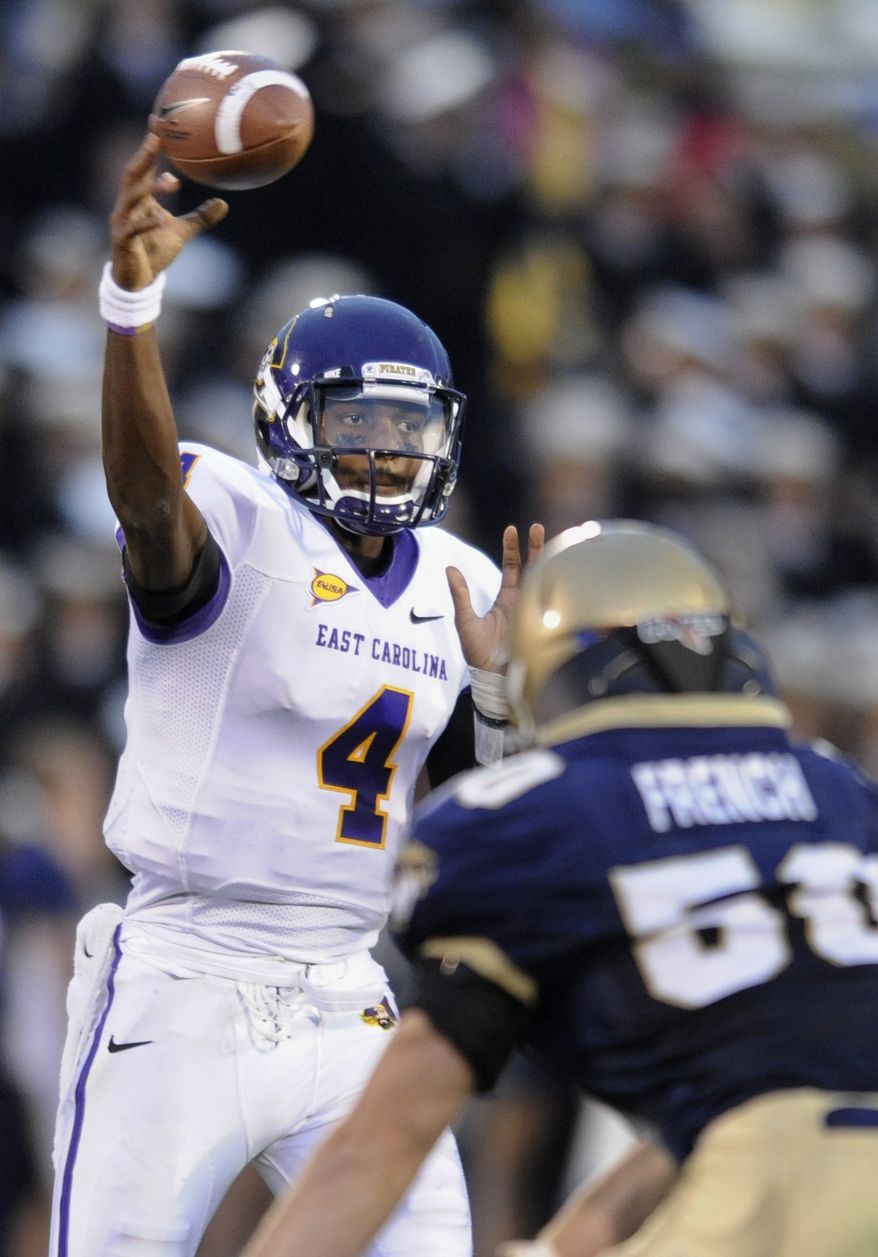 East Carolina quarterback Dominique Davis went 40-for-45 for 372 yards and two touchdowns against Navy on Saturday. East Carolina won 38-35. (AP Photo/Gail Burton)
