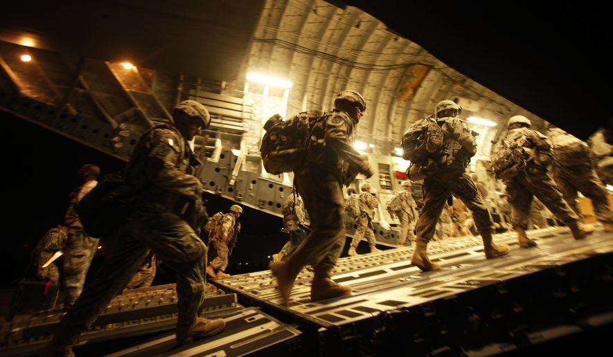 ** FILE ** In this Tuesday, July 13, 2010, file photo, U.S. Army soldiers from 2nd Brigade, 10th Mountain Division board a C-17 aircraft at Baghdad International Airport as they begin their journey to the United States. (AP Photo/Maya Alleruzzo, File)