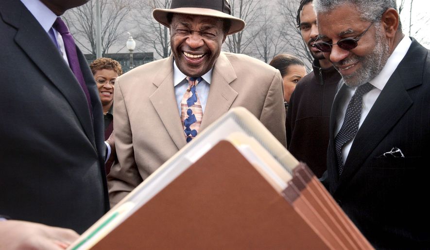 David W. Wilmot (right), a power broker in the District since Marion Barry was first elected mayor, lobbies for Wal-Mart and has ties to city-owned land where a store is to be built. (The Washington Times)