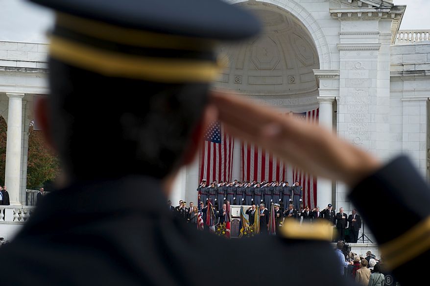 New York Army National Guard Chaplain1st. Lt. Raziel Amar salutes during the sining of the National Anthem during the dedication of the Jewish Chaplains Memorial in the Memorial Amphitheater at Arlington National Cemetery in Arlington, Va, Monday, October 24, 2011. (Rod Lamkey Jr/The Washington Times)