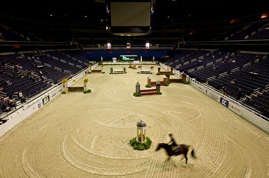 Liza Boyd of Los Angeles rides her horse "Arcadia" on the first day of the annual Washington International Horse Show on Oct. 25, 2011, in D.C. The event runs Oct. 25-30 at the Verizon Center and features top riders and horses competing from the U.S. and abroad. (Andrew Harnik/The Washington Times)