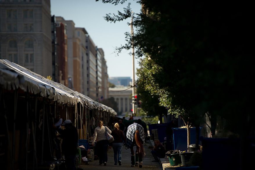 A horse is taken back to the stables on F Street in D.C., outside the Verizon Center on the first day of the annual Washington International Horse Show on Oct. 25, 2011. The event runs Oct. 25-30 at the Verizon Center and features top riders and horses competing from the U.S. and abroad. (Andrew Harnik/The Washington Times)