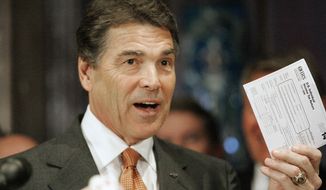 Republican presidential candidate Texas Gov. Rick Perry holds up the tax form he says that Americans would fill out as he outlined a broad economic proposal of a flat 20 percent income tax rate during a news conference Tuesday, Oct. 25, 2011, at the State House in Columbia, S.C. (AP Photo/Mary Ann Chastain)