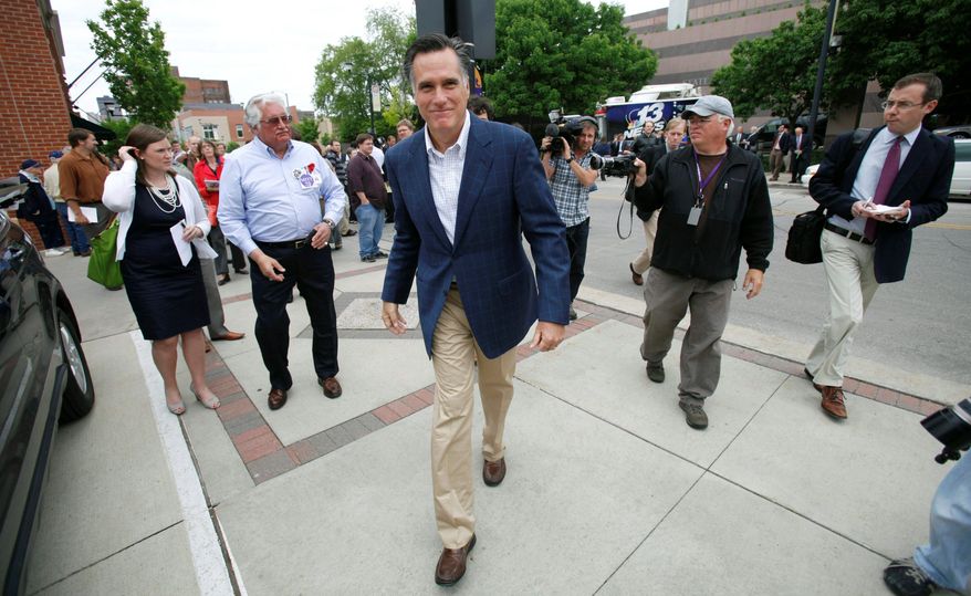 Former Massachusetts Gov. Mitt Romney, a Republican presidential candidate, exits after speaking at an event in Des Moines, Iowa, in May. &quot;I&#39;d love to win Iowa, any of us would. I will be here again and again, campaigning here,&quot; Mr. Romney said recently in Sioux City. (Associated Press)