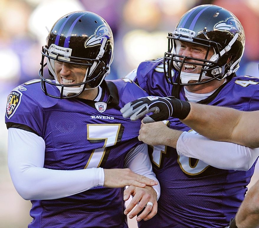 Kicker Billy Cundiff (left) is congratulated by long snapper Morgan Cox after his 25-yard field goal as time expired gave Baltimore a 30-27 win over Arizona. The Ravens trailed 24-3 at halftime. (Associated Press)