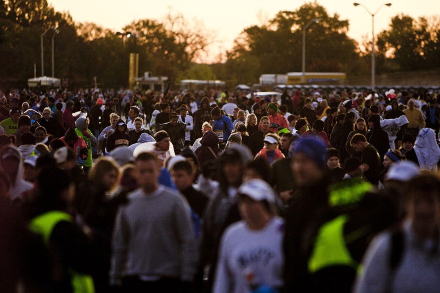 Runners make their way to the start of the the 36th Marine Corps Marathon in Arlington, Va. on Oct. 30, 2011.
(T.J. Kirkpatrick/ The Washington Times)