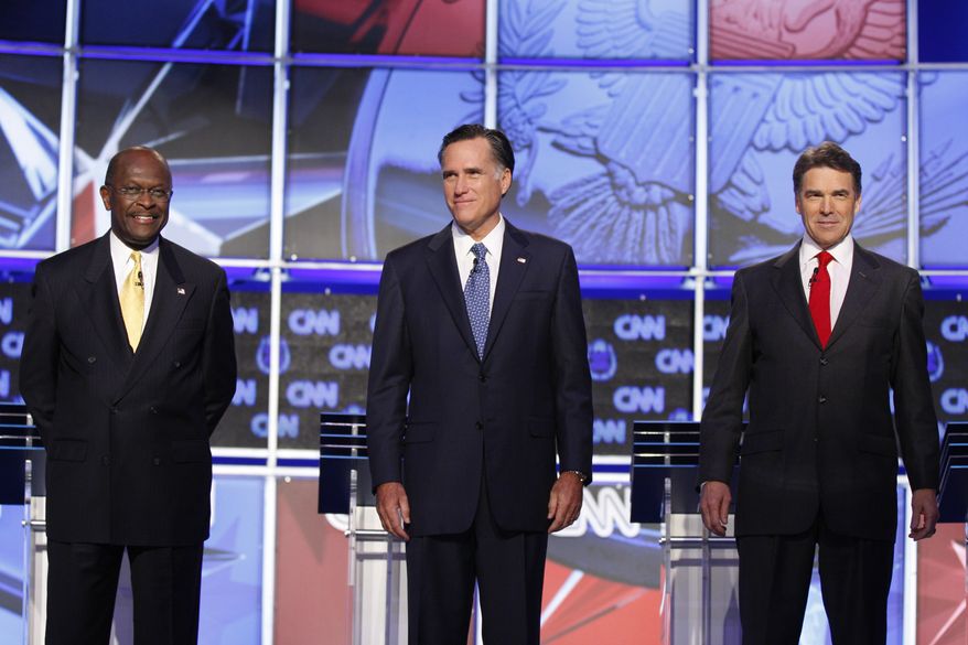 ** FILE ** Businessman Herman Cain (left), former Massachusetts Gov. Mitt Romney (center) and Texas Gov. Rick Perry are pictured before a Republican presidential debate on Tuesday, Oct. 18, 2011, in Las Vegas. (AP Photo/Isaac Brekken)
