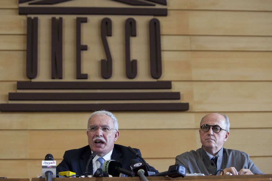 Palestinian Foreign Minister Riad al-Maliki (left) and Elias Sanbar, historian and ambassador for Palestine at UNESCO, face the media during a press conference at UNESCO's 36th General Conference in Paris on Oct. 31, 2011. (Associated Press)