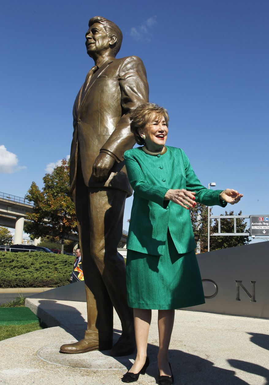 Elizabeth Dole, who served as the Transportation Secretary under President Ronald Reagan, greets guests Nov. 1, 2011, at the unveiling of a statue of Reagan at Washington&#39;s Ronald Reagan National Airport. (Associated Press