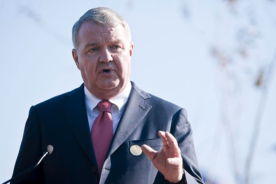 Charles Snelling, chairman of the board of the Metropolitan Washington Airports Authority, speaks at a dedication ceremony for a bronze statue of Ronald Reagan at Reagan National Airport in Arlington, Va., on Nov. 1, 2011. The statue was unveiled as part of a dedication ceremony on the centennial of the former president's birth. (T.J. Kirkpatrick/The Washington Times)
