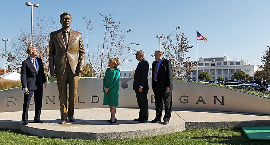 From left: Frederick Ryan Jr., chairman of the Board of Trustees of the Ronald Reagan Presidential Foundation; former Transportation Secretary Elizabeth Dole; Transportation Secretary Ray LaHood and Charles Snelling, chairman of the Board of the Metropolitan Washington Airports Authority, unveil the statue of President Reagan, on Nov. 1, 2011, at Washington&#39;s Ronald Reagan National Airport. (Associated Press)