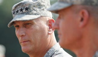 Gen. Raymond T. Odierno, Chief of Staff of the Army,right, and Gen. David M. Rodriguez wait to be introduced during Forces Command Assumption of command ceremony at Fort Bragg, N.C., Monday, Sept. 12, 2011. (AP Photo/Jim R. Bounds)