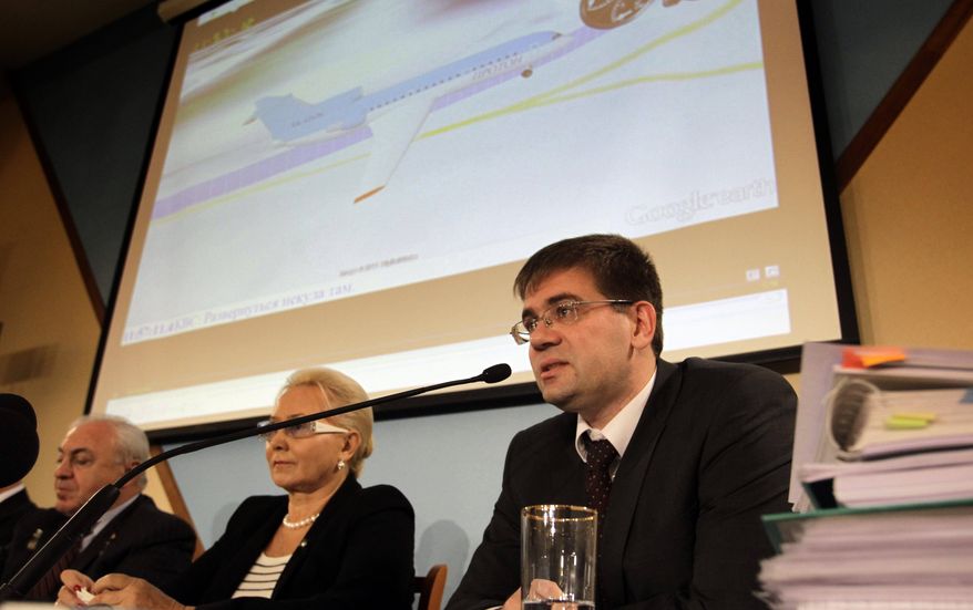 Alexei Morozov (right), a member of the technical commission of Russia's Interstate Aviation Committee, speaks during news conference on Wednesday, Nov. 2, 2011. (AP Photo/Sergey Ponomarev)
