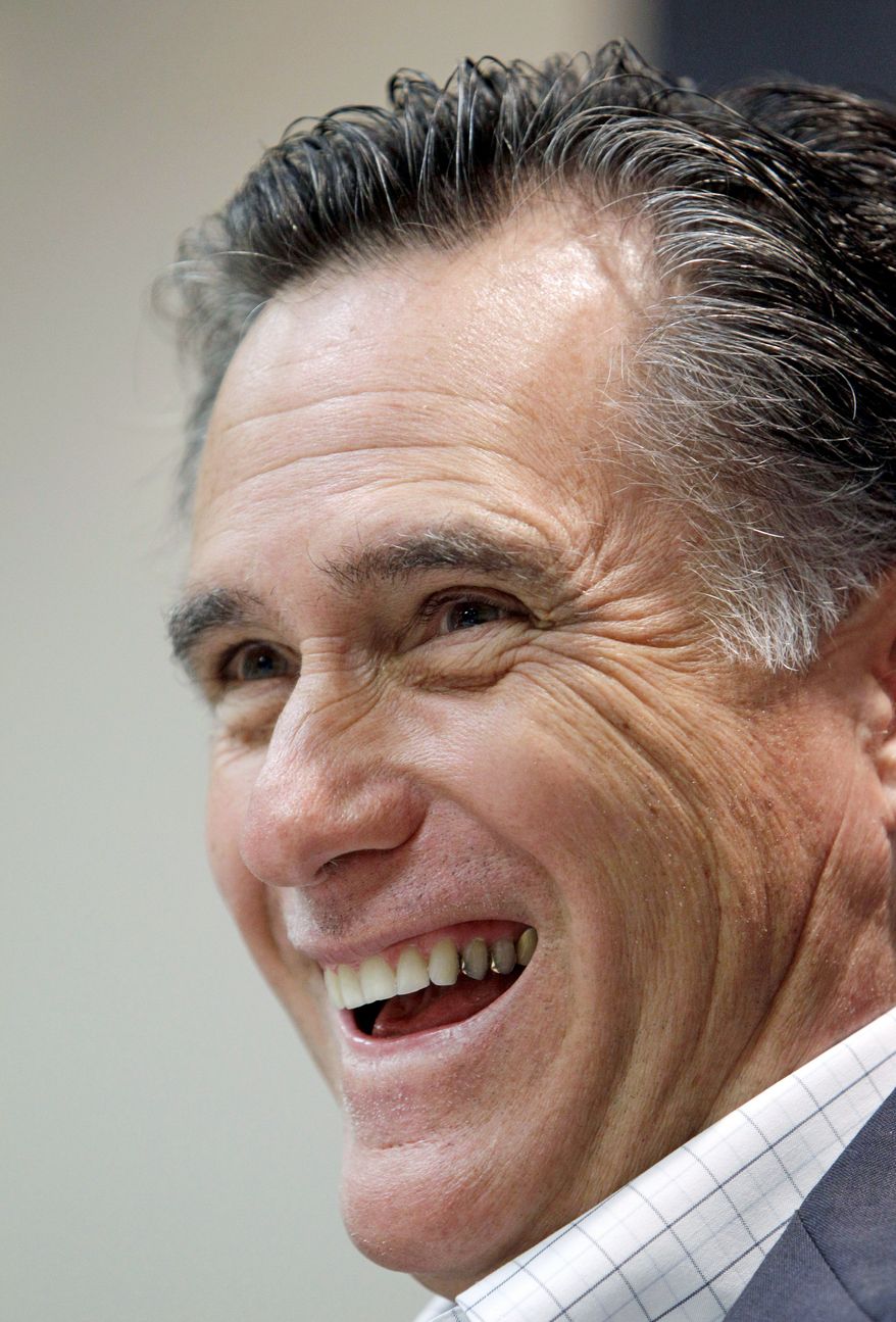 Former Massachusetts Gov. Mitt Romney speaks during an economic roundtable at the Treynor State Bank in Treynor, Iowa, on Thursday. (Associated Press)