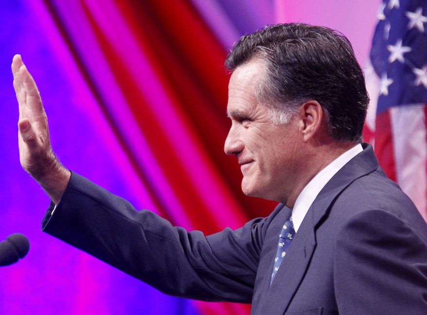 Former Massachusetts Gov. Mitt Romney waves after speaking at the Defending the American Dream Summit in Washington on Nov. 4, 2011. (Associated Press)