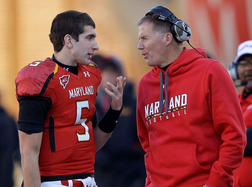 Maryland quarterback Danny O'Brien and coach Randy Edsall talk on the sideline after O'Brien threw an interception during the Terrapins' 31-13 loss to Virginia. (Associated Press)