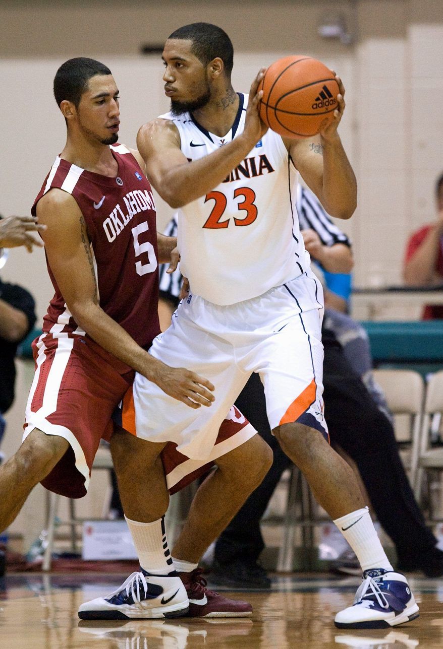 Forward Mike Scott needs six double-doubles to take over third place on Virginia's all-time list behind Ralph Sampson and Travis Watson. (Associated Press)