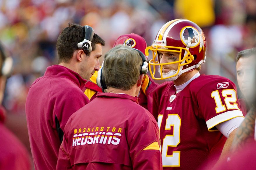 Washington Redskins quarterback John Beck talks with offensive coordinator Kyle Shanahan and head coach Mike Shanahan during the game against the San Francisco 49ers. A source confirmed to The Washington Times that Beck split first-team reps with Rex Grossman in preparation for Sunday's game against the Miami Dolphins. (Andrew Harnik / The Washington Times)