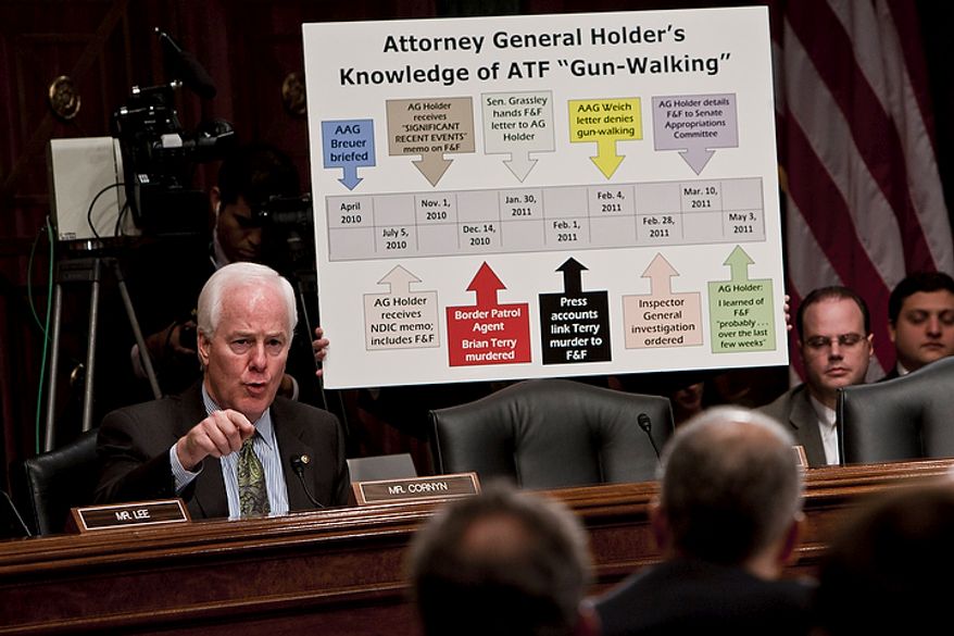 Sen. John Cornyn, Texas Republican, grills U.S. Attorney General Eric H. Holder Jr. (in foreground) on the Bureau of Alcohol, Tobacco, Firearms and Explosives&#x27; controversial gun-smuggling tactics during a Senate Judiciary Committee hearing in Washington on Tuesday, Nov. 8, 2011. (T.J. Kirkpatrick/The Washington Times)