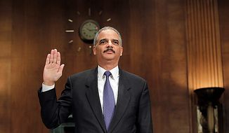 Attorney General Eric H. Holder Jr. is sworn in on Capitol Hill in Washington on Tuesday, Nov. 8, 2011, before testifying before a Senate Judiciary Committee hearing on the arms-trafficking investigation of &quot;Operation Fast and Furious.&quot; (AP Photo/J. Scott Applewhite)