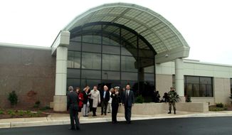 ** FILE ** Visitors leave the Charles C. Carson Center for Mortuary Affairs at Dover Air Force Base in Delaware after opening ceremonies in October 2003. (AP Photo/Dee Marvin, File)