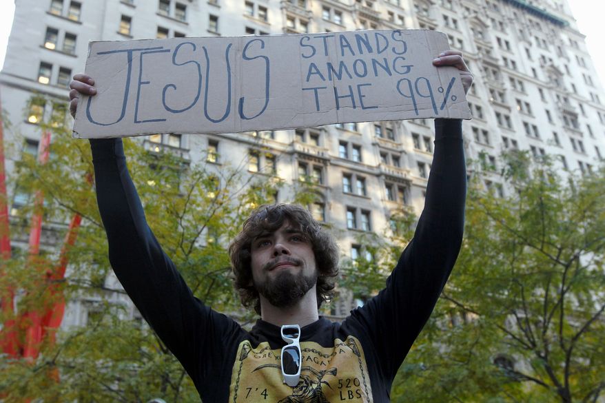 Will Portal, of Suffolk County, N.Y., expresses his views Wednesday at the Occupy Wall Street encampment at Zuccotti Park in New York. Global Language Monitor has selected "occupy" as its "top word of 2011."
Associated Press
