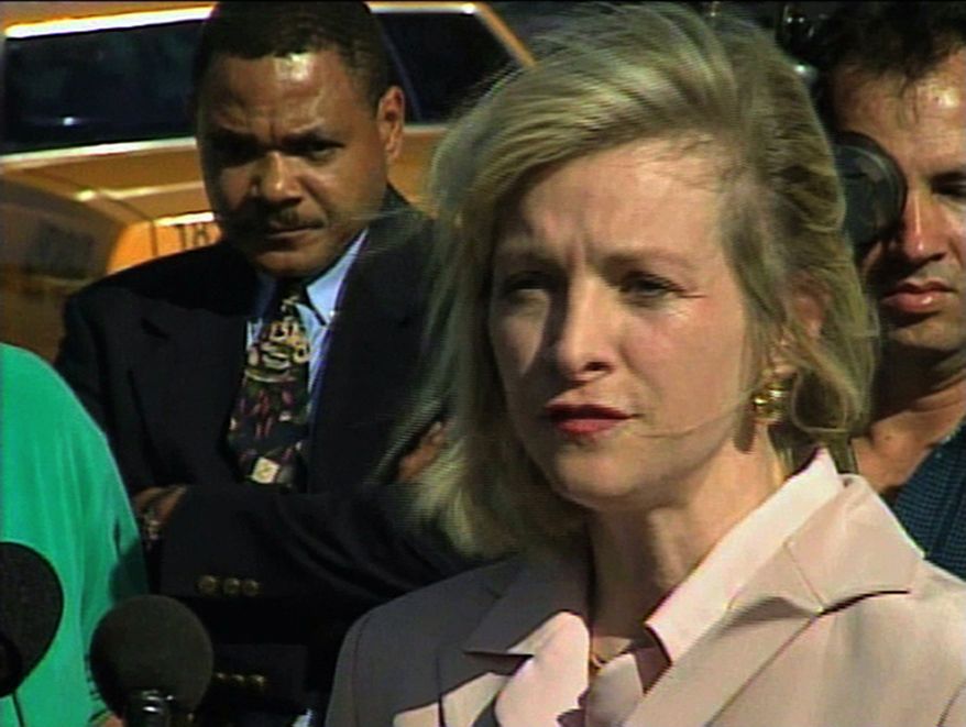 ** FILE ** This March 2000 image from video shows then-Immigration and Naturalization Service spokesperson Karen Kraushaar at a news conference in Miami regarding Elian Gonzalez. The Associated Press has chosen to publish Kraushaar's name, after independently confirming she was one of the accusers who filed sexual harassment complaints against Herman Cain when she and Cain worked at a restaurant trade group. (AP Photo/APTN)