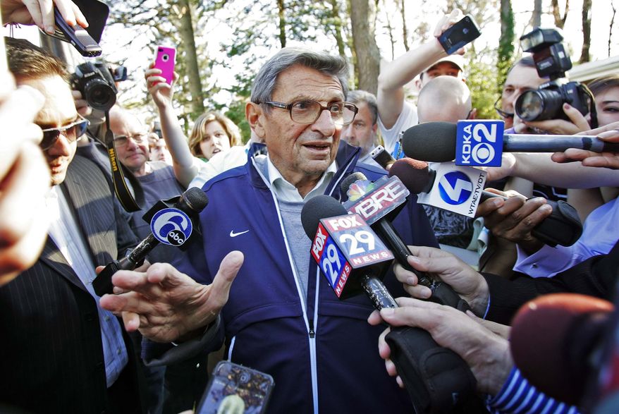 ** FILE ** Penn State football coach Joe Paterno speaks briefly to reporters as he leaves for football practice, Tuesday, Nov. 8, 2011, in State College, Pa. (AP Photo/The Citizens' Voice, Michael R. Sisak)