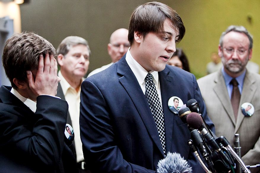 Jimmy Hoover, 19, left, and Charlie Hoover, center, younger and older brothers, respectively, of John Hoover, a victim killed in crash by Kevin Coffay, speak to the press after Coffay, 20, pled guilty in Montgomery County Circuit Court on three counts of vehicular manslaughter and one count of leaving the scene of a fatal crash, in Rockville, Md. on Nov. 10, 2011. "When I go home, Johnnie's not going to be there," said Jimmy Hoover, "I didn't know how much I had until he was gone."
(T.J. Kirkpatrick/ The Washington Times)