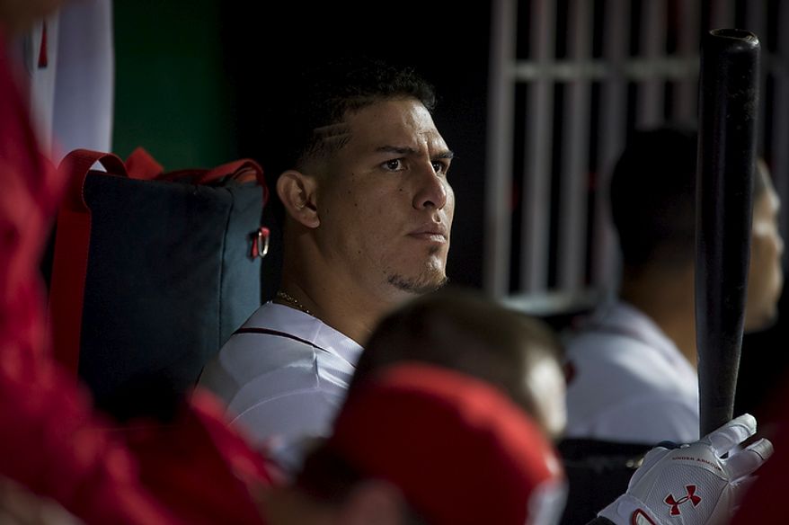 Washington Nationals catcher Wilson Ramos waits for his turn at bat in the dugout in the bottom of the eighth inning as the Nationals host the Los Angeles Dodgers at Nationals Park in Washington on Tuesday, Sept. 6, 2011. Ramos' mother, Maria Campos, and his younger sister, Milanyela Ramos, from Valencia, Venezuela, were granted visas to visit him and to watch him for the first time in the major leagues. (Rod Lamkey Jr./The Washington Times)