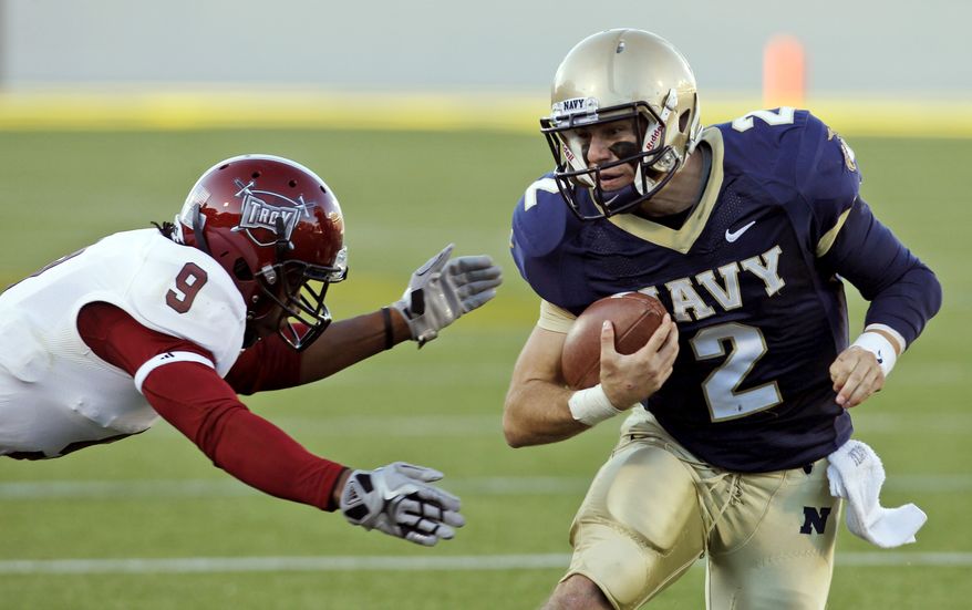 Navy quarterback Kriss Proctor threw for 127 yards and a touchdown against Troy last Saturday. He also added two scores on the ground in the Mids' 42-14 win. (AP Photo/Ann Heisenfelt)