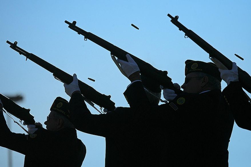 Members of the Honor Guard give a 21 gun salute to close the Veterans Day Program at Veterans Memorial Park in Tuscaloosa, Ala. Friday, Nov. 11, 2011. (AP Photo/The Tuscaloosa News, Dusty Compton)