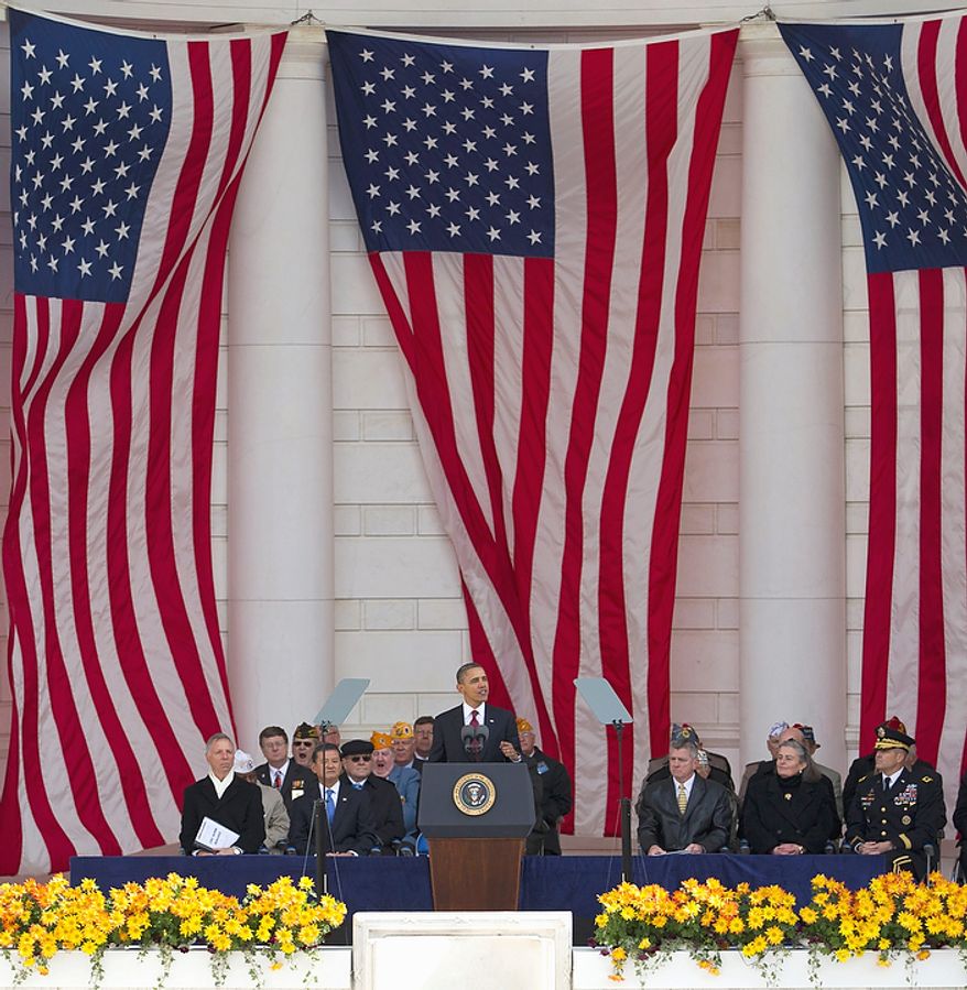 President Barack Obama speaks during a Veterans Day ceremony at Arlington National Cemetery in Arlington, Va., Friday, Nov. 11, 2011. (AP Photo/Evan Vucci)