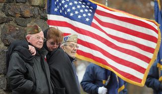 From left,  World War II veteran Angelo Basso, of Palmer Township, Pa. granddaughter Tammie Kelshaw, of Northampton, and brother World War II veteran Jack Basso, of Palmer Township, stand and listen during a Veterans Day ceremony at Upper Hackett Park in Easton, Pa on  Friday, Nov. 11, 2011.   (AP Photo/The Express-Times, Matt Smith)