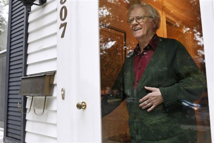 In this photo taken Wednesday, Oct. 12, 2011, Irving Lindenblad, 82, poses for a portrait in his home in Washington. Those who rely on villages can't imagine living any other way. Irving Lindenblad, 82, joined Palisades Village in northwest Washington a few years ago along with his wife, who died last year. Lindenblad has kidney cancer, and would have moved into assisted living if it wasn't for the village. Instead, he's staying in the house and neighborhood he loves. (AP Photo/Jacquelyn Martin)