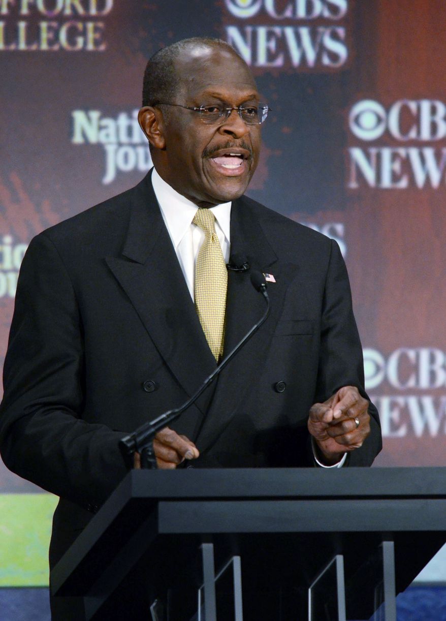 Republican presidential hopeful Herman Cain, seen here at a candidates debate on CBS-TV Saturday night in Spartanburg, S.C., has been critical of the media's coverage of his campaign. (Associated Press)