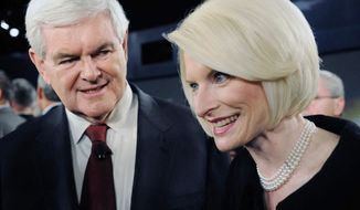 Republican presidential hopeful Newt Gingrich greets wife Callista after a candidates&#39; debate Saturday in Spartanburg, S.C. “I believe if we can win South Carolina, we will win the nomination,” the former House speaker says of the Jan. 21 South Carolina primary. (Associated Press)