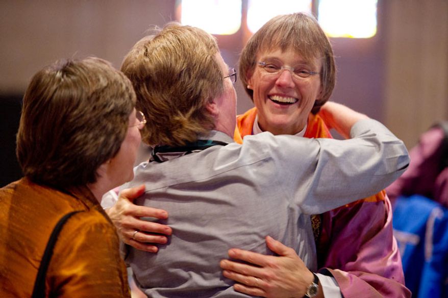 The Reverend Dr. Mariann Edgar Buddle, right, the newly seated ninth bishop of Washington. (Andrew Harnik / The Washington Times)