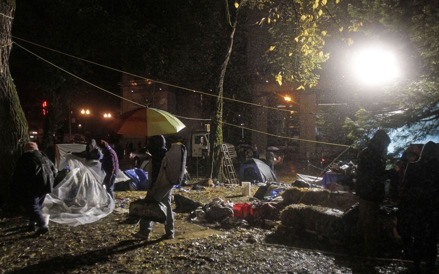 Protesters in Portland, Ore., pack up and leave hours before a mandate from the city to vacate the Occupy Portland Camp on Nov. 12, 2011. (Associated Press)